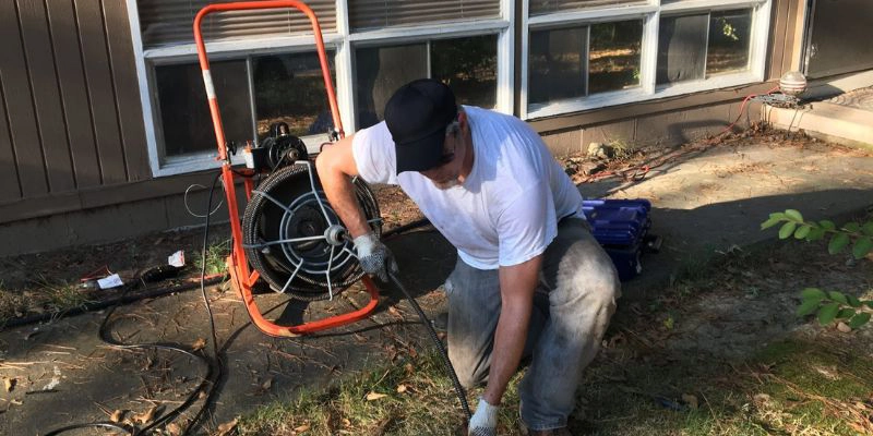 Professional drain cleaning equipment in action